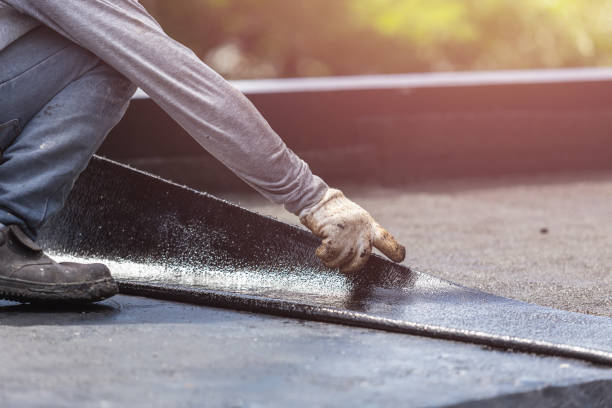 Professional Basement Waterproofing technician working in Newark, AR